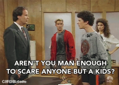 Man In Suit Talking To Man In Red Jacket And Woman GIF