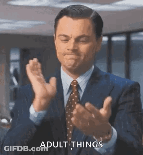 Man In Suit Talking To Man In White Shirt GIF