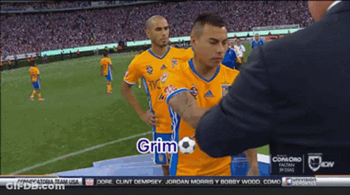 Man In Suit Talking To Soccer Player Grimo GIF
