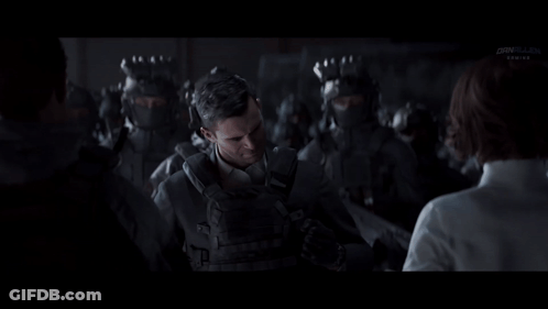 Man In Suit Talking To Woman Before Soldiers GIF