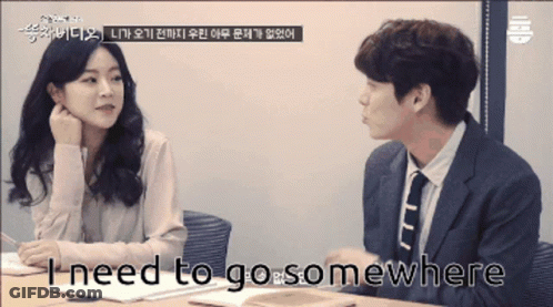 Man In Suit Talking To Woman GIF