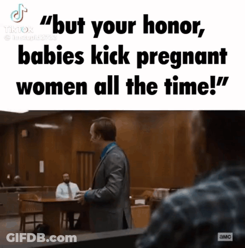 Man In Suit Talking To Woman In Courtroom GIF