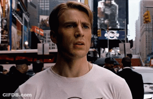 Man In Suit Talking To Woman In Crowd GIF