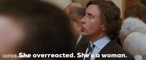 Man In Suit Talking To Woman In Crowd GIF