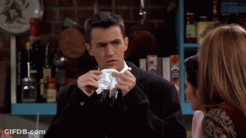 Man In Suit Talking To Woman In Kitchen GIF