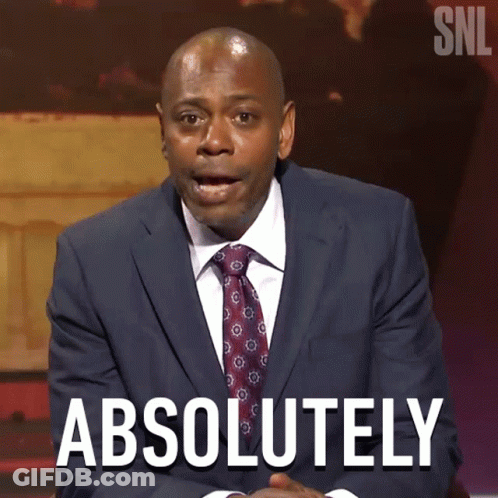 Man In Suit Talking To Woman In Purple GIF