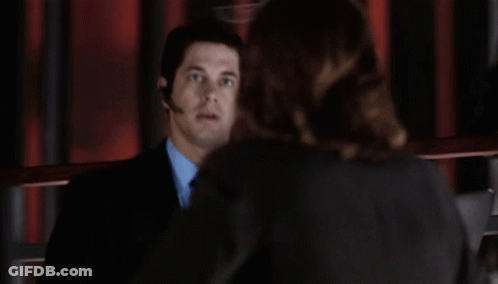 Man In Suit Talking To Woman In Suit GIF