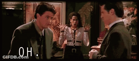 Man In Suit Talking To Woman In White Shirt GIF