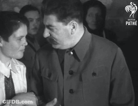 Man In Suit Talking To Woman GIF