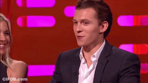 Man In Suit Talking To Woman On Red Background GIF