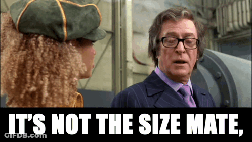 Man In Suit Talking To Woman Saying It's Not The Size Mate GIF