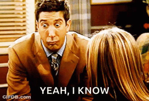Man In Suit Talking To Woman Saying Yeah I Know GIF