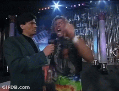 Man In Suit Talking To Wrestler Saying Ever GIF