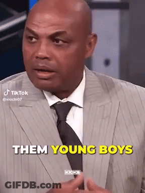 Man In Suit Talking To Young Boy GIF