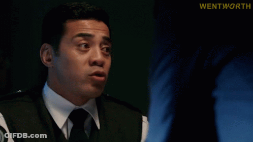 Man In Suit Talking With Find Her Behind Him GIF
