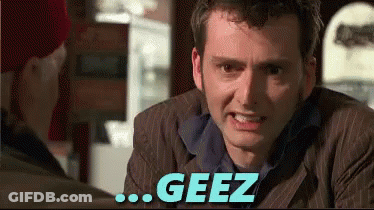 Man In Suit Talking With Geez Above GIF