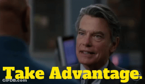 Man In Suit Talks To Another Saying Take Advantage GIF