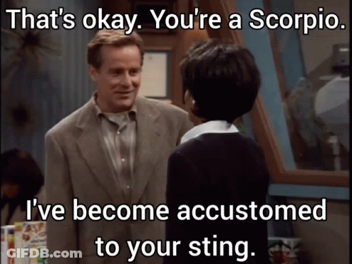 Man In Suit Talks To Woman Saying That's Okay You're A Scorpio GIF