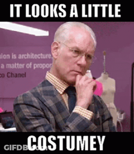Man In Suit Thinking It Looks A Little Costumey GIF