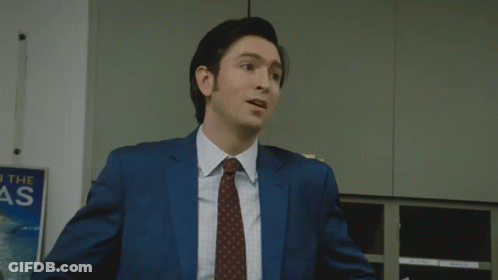 Man In Suit Thumbs Up In Front Of Reach The As Sign GIF