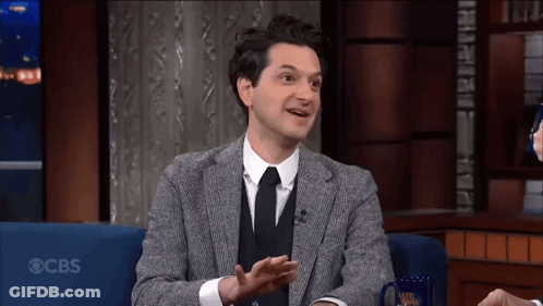 Man In Suit Tie Glasses With Model Ship GIF