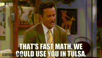Man In Suit Tie Sitting On Couch Saying That's Fast Math GIF