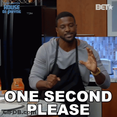 Man In Suit Tying Bow Tie GIF