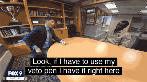 Man In Suit Using Veto Pen GIF