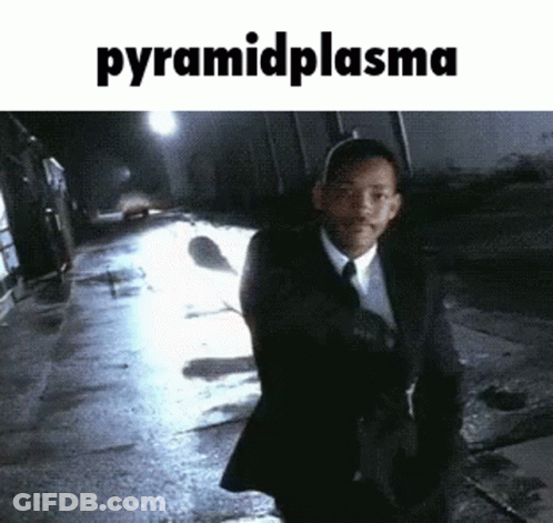 Man In Suit Walking At Night Pyramid Plasma GIF