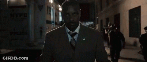Man In Suit Walking City Street At Night GIF