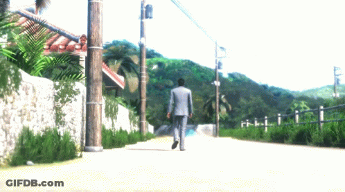 Man In Suit Walking Dirt Road GIF