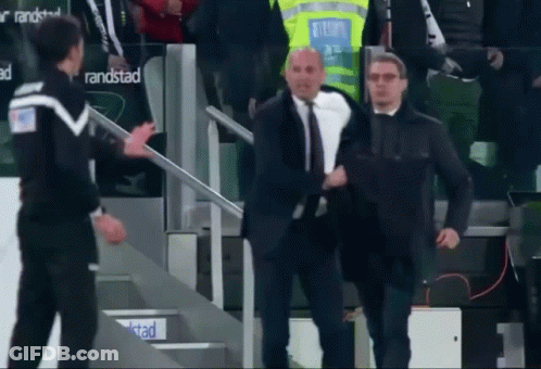 Man In Suit Walking Down Stairs In Front Of Randstad Sign GIF