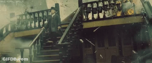 Man In Suit Walking Down Stairs GIF