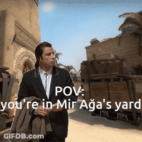 Man In Suit Walking Down Street With POV You're In Mir Aga's Yard GIF