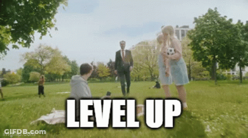 Man In Suit Walking In Park With Woman Holding Soccer Ball Level Up GIF