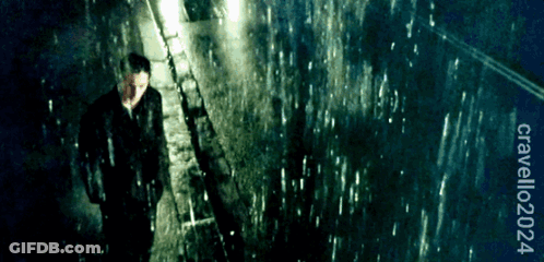 Man In Suit Walking In Rain GIF
