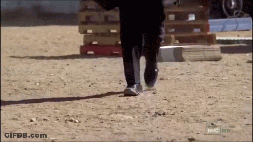 Man In Suit Walking On Dirt Road With BMC GIF