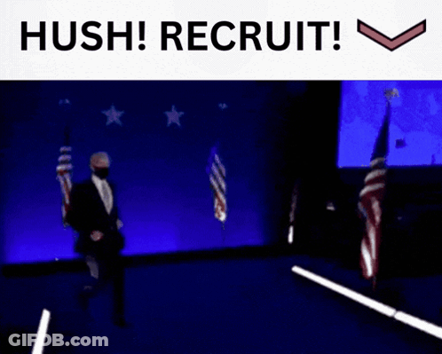 Man In Suit Walking On Stage With Hush Recruit GIF