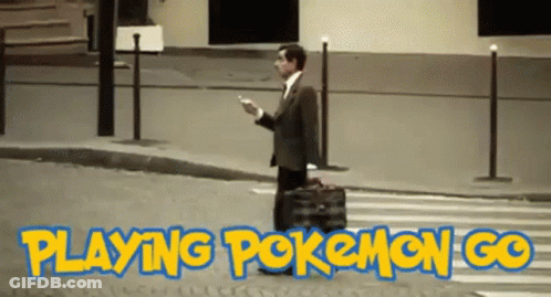 Man In Suit Walking Playing Pokemon Go GIF