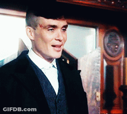 Man In Suit Walking Through Field GIF