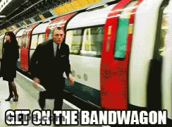 Man In Suit Walking To Train Get On The Bandwagon GIF