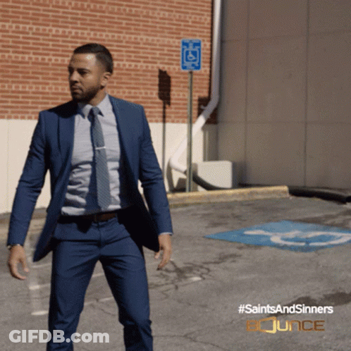 Man In Suit Walking With Saintsandsinners Bounce GIF