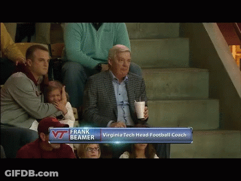 Man In Suit Watching Football With Frank Beamer GIF
