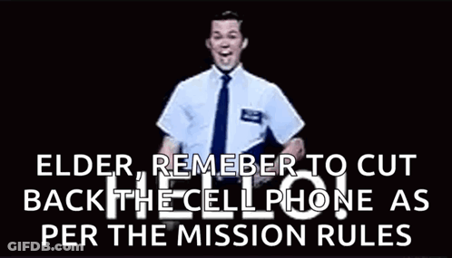 Man In Suit Waving At Camera GIF