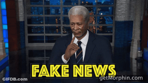 Man In Suit Waving At Fake News GIF