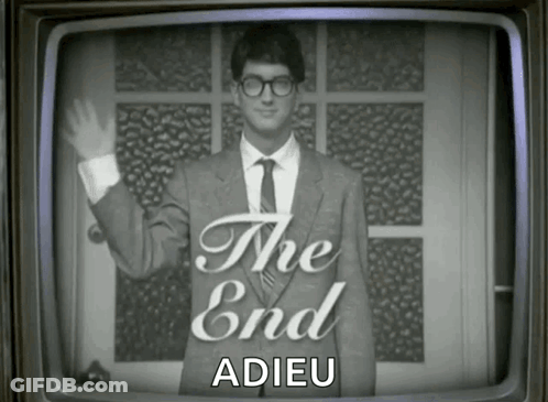 Man In Suit Waving In Front Of The End Screen GIF