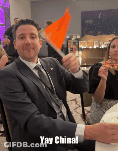 Man In Suit Waving Orange Flag Yay China GIF