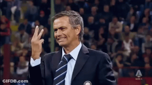 Man In Suit Waving GIF