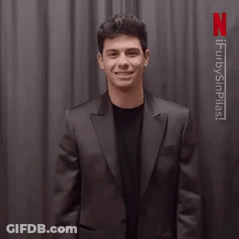 Man In Suit Waving Saying Gracias GIF
