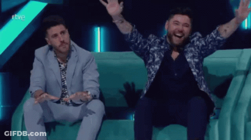 Man In Suit Waving Saying Gracias GIF